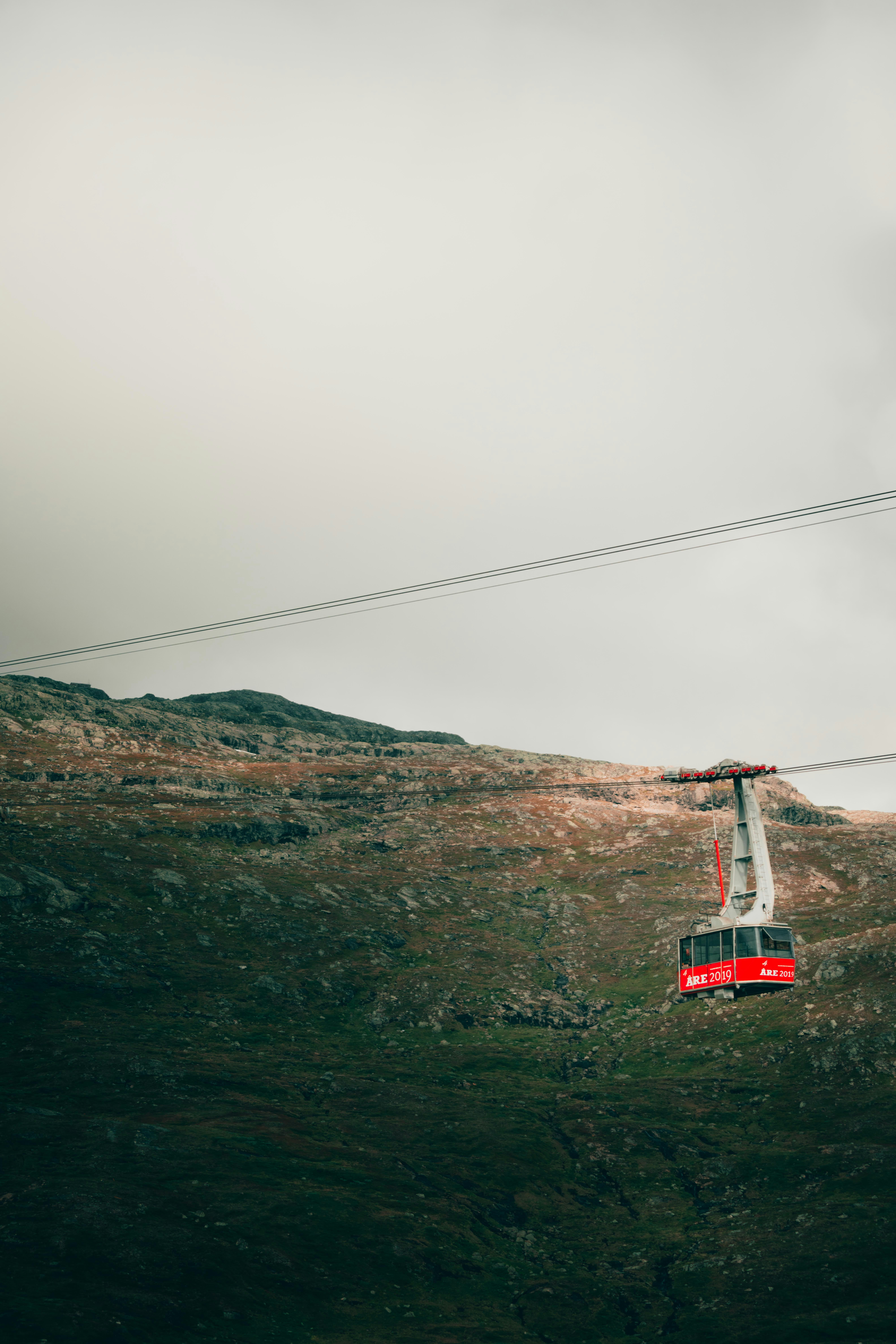 red cable car over the mountain
